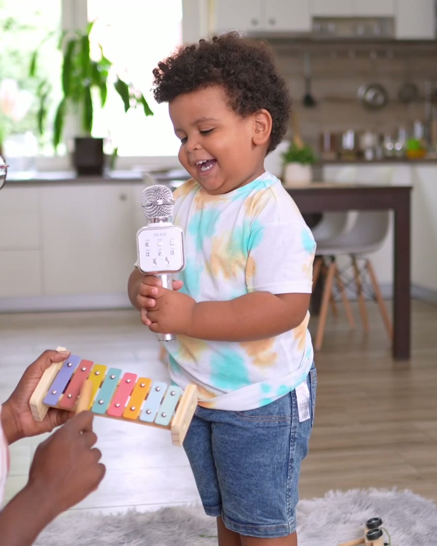 Sammy laughing on his sister's shoulders